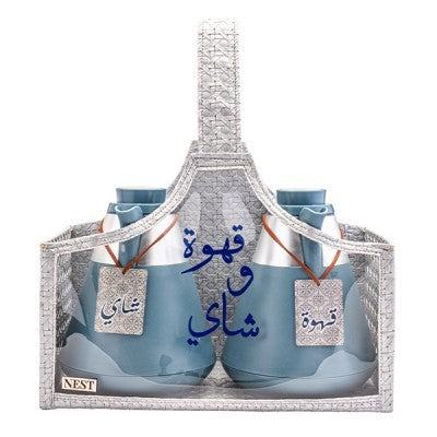 شنطة باليد مصنوعة من الجلد باللون الفضي مع مطارات